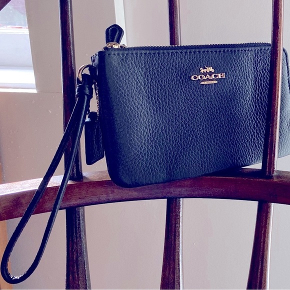 Coach Handbags - Black Coach wallet, double zip, gold details, wristlet, new condition, no tags.